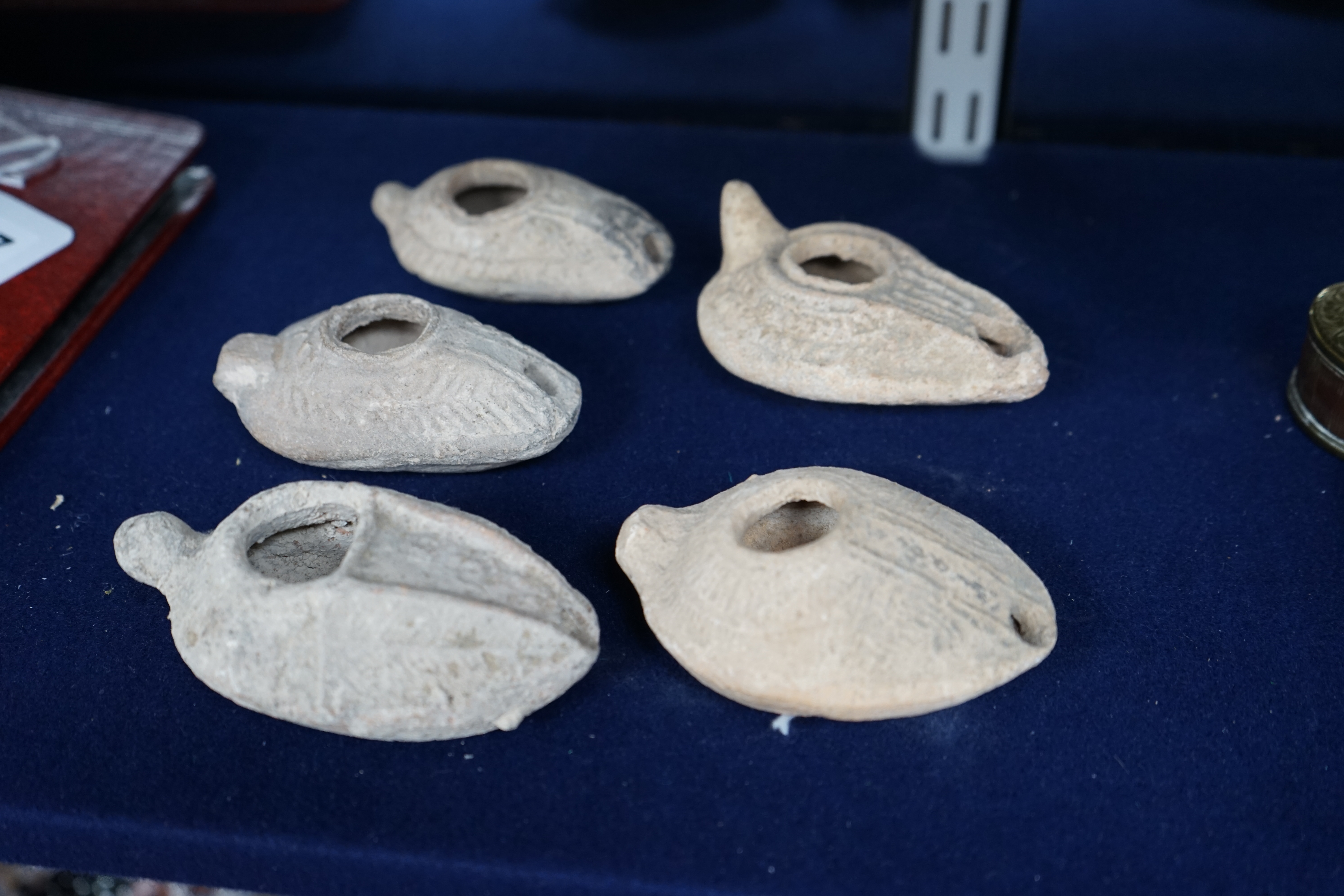 Five Roman terracotta oil lamps, 3rd century. Condition - poor to fair